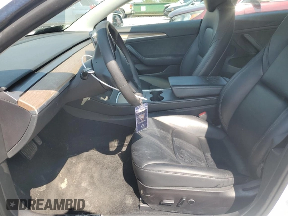 2023 Tesla Model 3 with VIN 5YJ3E1EA8PF449797, listed as a Copart auction lot 64601115 with 99,771 mi miles and Clean title. Bid and sale history available at DreamBid. Image 7.