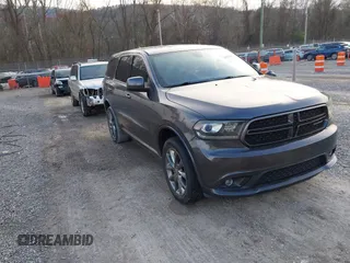 2015 Dodge Durango SXT with VIN 1C4RDJAG4FC784865, listed as a IAAI auction lot 40872452 with 145,877 mi miles and . Bid and sale history available at carsss.com. Image 1.