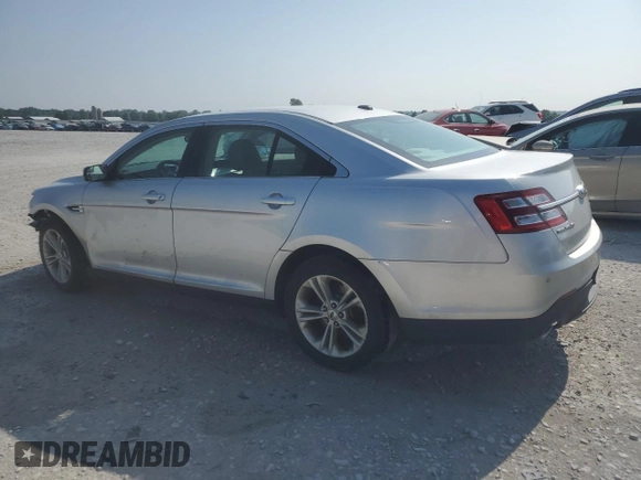 2015 Ford Taurus SEL with VIN 1FAHP2E80FG121013, listed as a Copart auction lot 59940235 with 209,632 mi miles and Clean title. Bid and sale history available at DreamBid. Image 2.