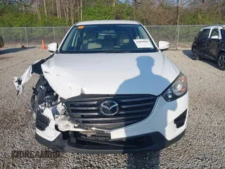 2016 Mazda CX-5 Sport with VIN JM3KE2BY2G0819604, listed as a IAAI auction lot 42059846 with 124,911 mi miles. Bid and sale history available at carsss.com. Image 12.