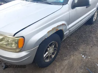 2002 Jeep Grand Cherokee Laredo z VIN 1J4GW48S62C261154, wystawiony jako IAAI lot #42602424 z przebiegiem 160 295 mil mil oraz . Historia ofert i sprzedaży dostępna na DreamBid. Obrazek 6.