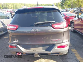 2014 Jeep Cherokee Trailhawk with VIN 1C4PJMBS6EW167517, listed as a IAAI auction lot 41947552 with 233,572 mi miles. Bid and sale history available at carsss.com. Image 17.