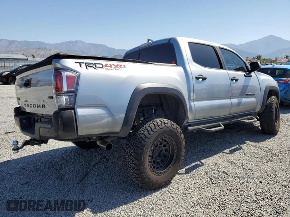 2023 Toyota Tacoma SR with VIN 3TMCZ5AN8PM545588, listed as a Copart auction lot 57528655 with 73,286 mi miles and Salvage title. Bid and sale history available at DreamBid. Image 3.