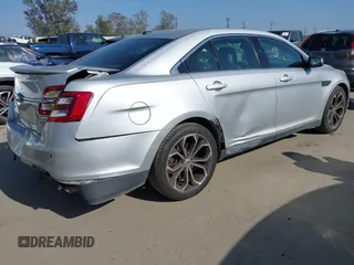 2014 Ford Taurus SHO with VIN 1FAHP2KT8EG123342, listed as a IAAI auction lot 42095390 with 142,957 mi miles. Bid and sale history available at carsss.com. Image 4.