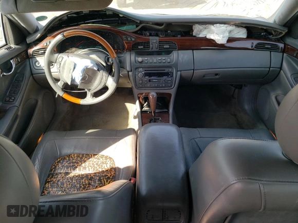 2004 Cadillac DeVille DTS z VIN 1G6KF57994U203706, wystawiony jako Copart lot #76278324 z przebiegiem 203 709 mil mil oraz Szkoda całkowita • Salvage title. Historia ofert i sprzedaży dostępna na DreamBid. Obrazek 8.