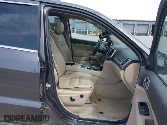 2014 Jeep Grand Cherokee Overland with VIN 1C4RJFCT6EC187098, listed as a IAAI auction lot 42077453 with 172,220 mi miles and . Bid and sale history available at DreamBid. Image 5.