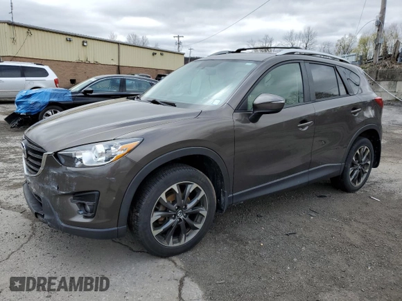 2016 Mazda CX-5 Grand Touring with VIN JM3KE4DY5G0848717, listed as a Copart auction lot 53249895 with 86,746 mi miles and Salvage Title. Bid and sale history available at carsss.com. Image 1.