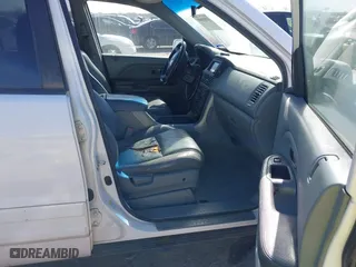 2005 Honda Pilot EX-L with NAVI with VIN 2HKYF18775H571312, listed as a IAAI auction lot 41830609 with 297,923 mi miles. Bid and sale history available at carsss.com. Image 5.