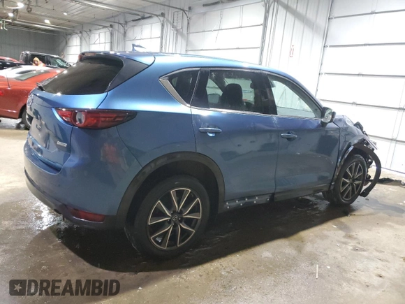 2018 Mazda CX-5 Grand Touring with VIN JM3KFBDM1J0304706, listed as a Copart auction lot 46123415 with 104,004 mi miles and Salvage title. Bid and sale history available at DreamBid. Image 3.
