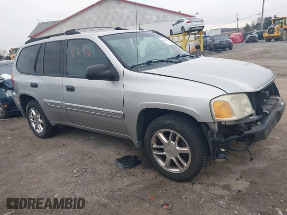 2004 GMC Envoy SLE with VIN 1GKDT13SX42135951, listed as a IAAI auction lot 41668252 with 216,193 mi miles. Bid and sale history available at carsss.com. Image 1.
