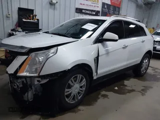 2014 Cadillac SRX Performance Collection with VIN 3GYFNFE36ES615440, listed as a IAAI auction lot 41830849 with 125,128 mi miles and . Bid and sale history available at DreamBid. Image 2.