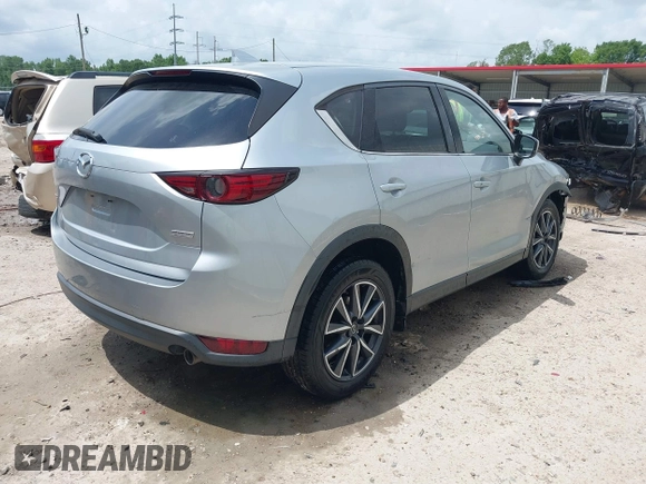 2018 Mazda CX-5 Grand Touring with VIN JM3KFADM6J0339185, listed as a IAAI auction lot 42160763 with 86,312 mi miles and . Bid and sale history available at DreamBid. Image 4.