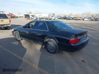 2002 Cadillac Seville Touring STS with VIN 1G6KY54972U193737, listed as a IAAI auction lot 41876511 with 165,571 mi miles. Bid and sale history available at carsss.com. Image 3.