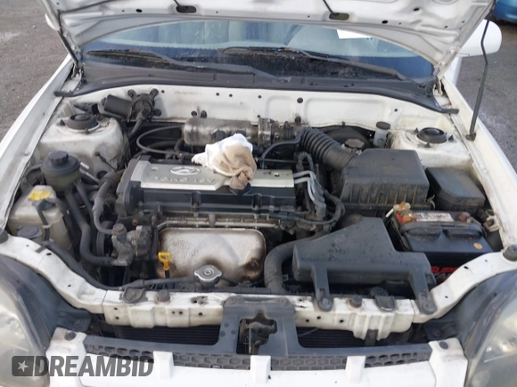 2004 Hyundai Accent GL with VIN KMHCG35C74U303431, listed as a IAAI auction lot 41725717 with 211,893 mi miles. Bid and sale history available at carsss.com. Image 10.