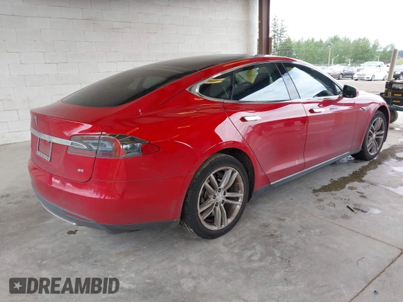 2013 Tesla Model S with VIN 5YJSA1CN7DFP26996, listed as a IAAI auction lot 42244540 with 128,160 mi miles and . Bid and sale history available at DreamBid. Image 4.