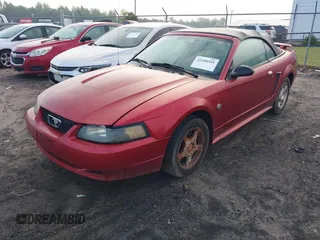 2004 Ford Mustang Deluxe with VIN 1FAFP44604F212319, listed as a IAAI auction lot 42100591 with 191,992 mi miles. Bid and sale history available at carsss.com. Image 2.