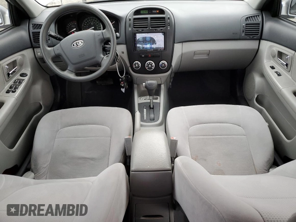 2009 Kia Spectra EX with VIN KNAFE221595657550, listed as a Copart auction lot 52805205 with 95,777 mi miles and Salvage Title. Bid and sale history available at DreamBid. Image 8.