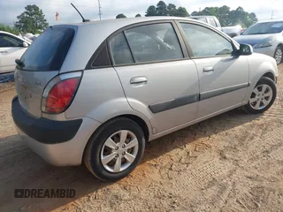 2009 Kia Rio LX with VIN KNADE243896483683, listed as a IAAI auction lot 42061404 with 88,614 mi miles. Bid and sale history available at carsss.com. Image 4.