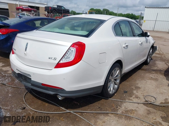 2014 Lincoln MKS z VIN 1LNHL9DK7EG601720, wystawiony jako IAAI lot #42464979 z przebiegiem 58 163 mil mil oraz . Historia ofert i sprzedaży dostępna na DreamBid. Obrazek 4.