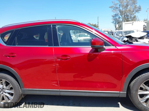 2021 Mazda CX-5 Grand Touring with VIN JM3KFADM5M0470483, listed as a IAAI auction lot 42785031 with 30,749 mi miles and . Bid and sale history available at DreamBid. Image 13.