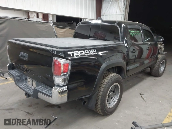 2021 Toyota Tacoma SR with VIN 3TMCZ5AN4MM448304, listed as a IAAI auction lot 42046932 with 56,161 mi miles and . Bid and sale history available at DreamBid. Image 4.