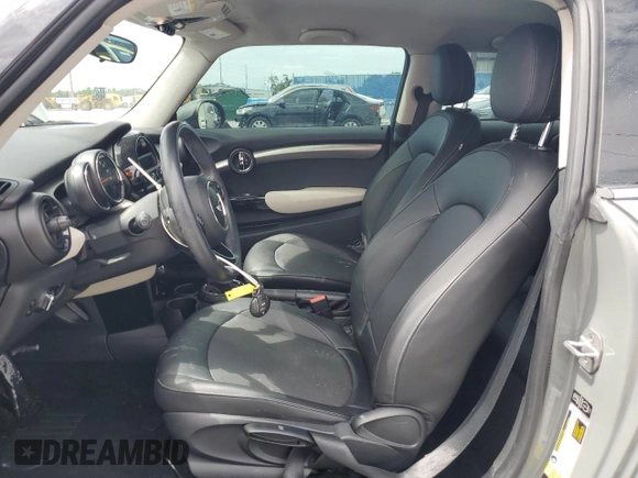 2014 MINI Hardtop with VIN WMWXM5C51ET934047, listed as a Copart auction lot 63039335 with 104,446 mi miles and Salvage title. Bid and sale history available at DreamBid. Image 7.