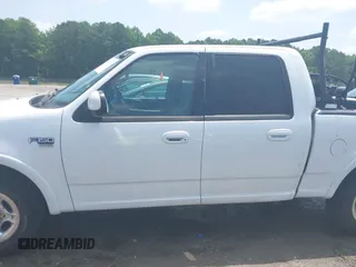 2001 Ford F-150 XLT with VIN 1FTRW07L91KB77612, listed as a IAAI auction lot 42432387 with 106,574 mi miles and . Bid and sale history available at DreamBid. Image 14.