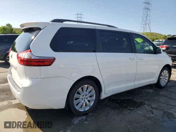 2015 Toyota Sienna LE with VIN 5TDJK3DC2FS126466, listed as a Copart auction lot 61165105 with 56,634 mi miles and Salvage title. Bid and sale history available at DreamBid. Image 3.