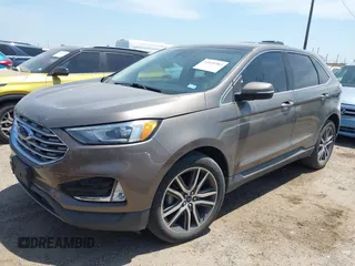 2019 Ford Edge Titanium z VIN 2FMPK3K91KBB48872, wystawiony jako IAAI lot #42020383 z przebiegiem 79 612 mil mil oraz . Historia ofert i sprzedaży dostępna na DreamBid. Obrazek 2.