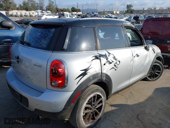 2015 MINI Countryman with VIN WMWZB3C56FWR43359, listed as a IAAI auction lot 40720320 with 69,898 mi miles and . Bid and sale history available at DreamBid. Image 4.