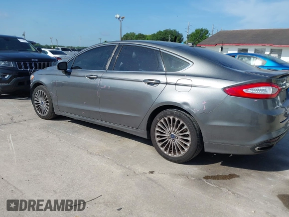 2014 Ford Fusion Titanium with VIN 3FA6P0K90ER358536, listed as a IAAI auction lot 41931474 with 170,856 mi miles. Bid and sale history available at carsss.com. Image 3.