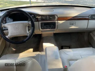1999 Cadillac DeVille DHS z VIN 1G6KE54Y9XU783302, wystawiony jako Copart lot #42375455 z przebiegiem Nie podano mil oraz Czysty tytuł • Clean title. Historia ofert i sprzedaży dostępna na DreamBid. Obrazek 9.