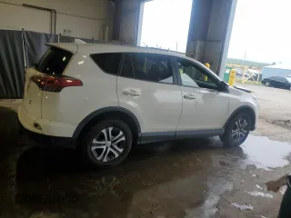 2018 Toyota RAV4 LE with VIN JTMBFREV2JJ182828, listed as a Copart auction lot 55668945 with 164,683 mi miles and Salvage Title. Bid and sale history available at DreamBid. Image 3.