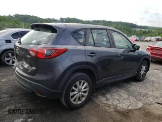 2014 Mazda CX-5 Sport with VIN JM3KE2BE9E0372370, listed as a Copart auction lot 58980165 with 175,477 mi miles and Salvage title. Bid and sale history available at DreamBid. Image 3.