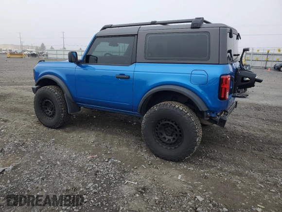 2023 Ford Bronco with VIN 1FMDE5AHXPLB26651, listed as a Copart auction lot 77497964 with 19,700 mi miles and Salvage Title. Bid and sale history available at carsss.com. Image 2.