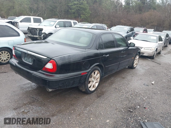 2004 Jaguar XJ with VIN SAJEA71C34SG10171, listed as a IAAI auction lot 41412081 with 150,488 mi miles. Bid and sale history available at carsss.com. Image 4.