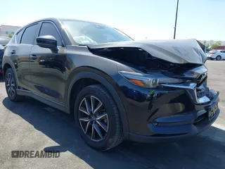 2018 Mazda CX-5 Grand Touring z VIN JM3KFADM7J0327272, wystawiony jako IAAI lot #42279536 z przebiegiem 97 478 mil mil oraz . Historia ofert i sprzedaży dostępna na DreamBid. Obrazek 1.
