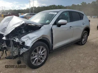 2019 Mazda CX-5 Grand Touring with VIN JM3KFADMXK0548866, listed as a Copart auction lot 62492065 with 65,899 mi miles and Salvage title. Bid and sale history available at DreamBid. Image 1.