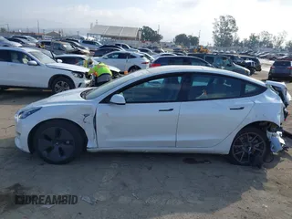 2022 Tesla Model 3 with VIN 5YJ3E1EA1NF167711, listed as a IAAI auction lot 41594266 with 50,554 mi miles and . Bid and sale history available at DreamBid. Image 14.
