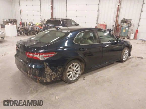 2020 Toyota Camry LE with VIN 4T1C11AK5LU926564, listed as a IAAI auction lot 41864812 with 104,212 mi miles and . Bid and sale history available at carsss.com. Image 4.