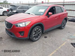 2016 Mazda CX-5 Grand Touring with VIN JM3KE2DY8G0871574, listed as a IAAI auction lot 41959686 with 95,416 mi miles and . Bid and sale history available at DreamBid. Image 17.
