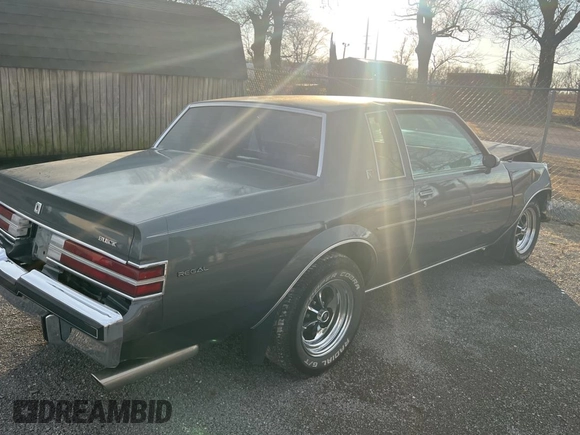 1987 Buick Regal with VIN 1G4GJ11Y4HP413978, listed as a Copart auction lot 87311954 with 52,519 mi miles and Salvage Title. Bid and sale history available at DreamBid. Image 4.