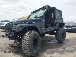 2004 Jeep Wrangler Rubicon z VIN 1J4FA69S84P727716, wystawiony jako IAAI lot #42162129 z przebiegiem 90 844 mil mil oraz . Historia ofert i sprzedaży dostępna na DreamBid. Obrazek 2.