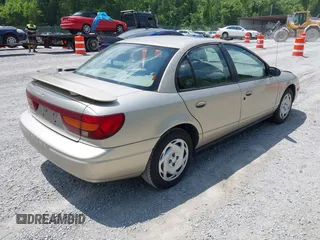 2001 Saturn SL z VIN 1G8ZK54721Z272773, wystawiony jako IAAI lot #42449133 z przebiegiem 56 714 mil mil oraz . Historia ofert i sprzedaży dostępna na DreamBid. Obrazek 4.