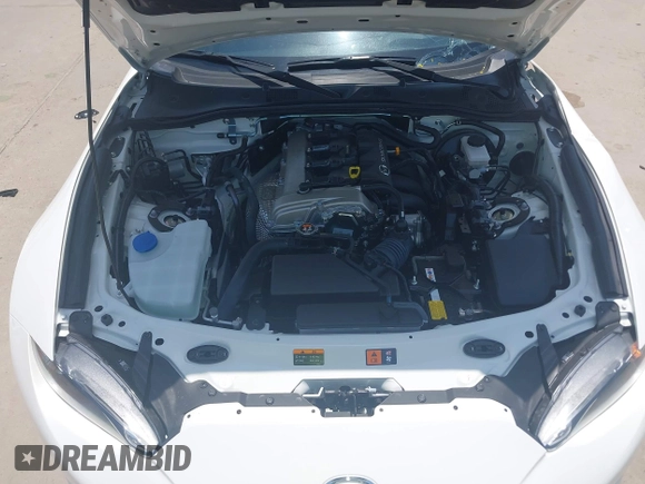 2021 Mazda MX-5 Miata Grand Touring z VIN JM1NDAM71M0457011, wystawiony jako IAAI lot #42427652 z przebiegiem 4 045 mil mil oraz . Historia ofert i sprzedaży dostępna na DreamBid. Obrazek 10.
