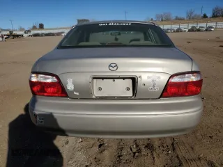 2002 Mazda 626 LX with VIN 1YVGF22C125279863, listed as a Copart auction lot 87103664 with 139,633 mi miles and Salvage Title. Bid and sale history available at carsss.com. Image 6.