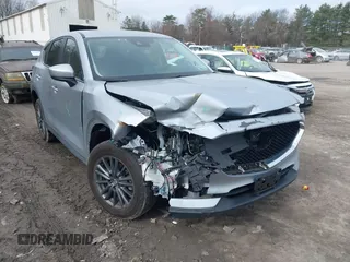 2021 Mazda CX-5 Touring with VIN JM3KFBCM9M1329806, listed as a IAAI auction lot 41825123 with 59,300 mi miles. Bid and sale history available at carsss.com. Image 6.
