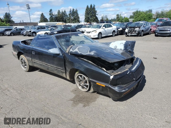 1992 Chrysler LeBaron z VIN 1C3XU4537NF129794, wystawiony jako Copart lot #71594804 z przebiegiem 156 624 mil mil oraz Szkody całkowita. Historia ofert i sprzedaży dostępna na DreamBid. Obrazek 4.