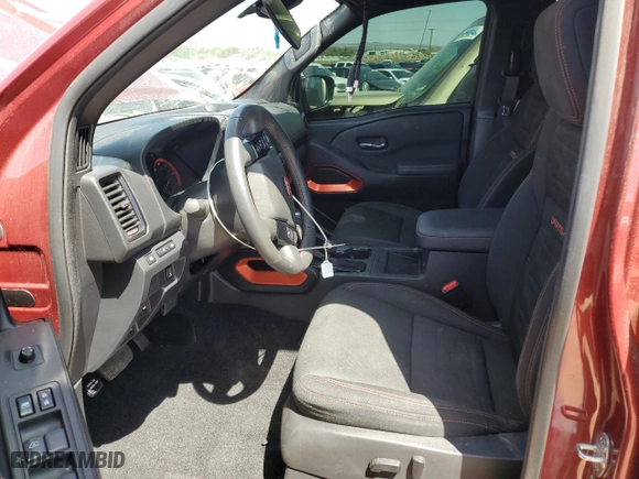 2023 Nissan Frontier PRO-4X with VIN 1N6ED1EK2PN618618, listed as a Copart auction lot 57197604 with 25,362 mi miles and Salvage Title. Bid and sale history available at carsss.com. Image 7.