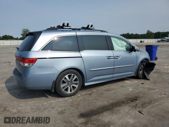 2014 Honda Odyssey Touring with VIN 5FNRL5H95EB080449, listed as a Copart auction lot 58489715 with 154,604 mi miles and Salvage title. Bid and sale history available at DreamBid. Image 3.